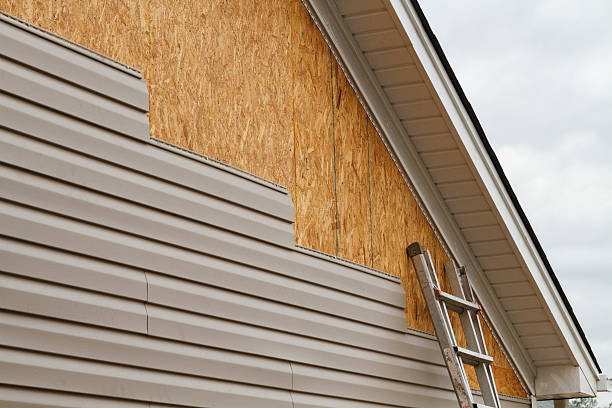 Professional Storm Damage Siding Repair technician working in Navarre, OH